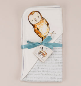 Olive owl blanket folded with ribbon and storybook tag