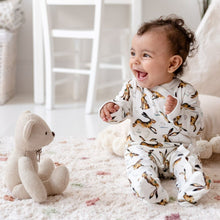 Load image into Gallery viewer, 6 month old baby girl laughing, sitting up, wearing Molly Hare print babygrow