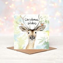 Load image into Gallery viewer, Christmas card with a deer illustration and &#39;Christmas Wishes&#39; text on a soft, blurred background.