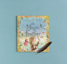 Load image into Gallery viewer, Book titled 'The Magic Feather' by Julia Donaldson and Catherine Rayner on a blue background with a feather in front.