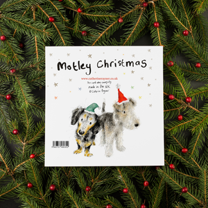 an image featuring the back of the christmas card saying Motley Christmas with two dogs in Santa hats on it.