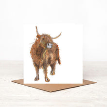 Load image into Gallery viewer, A white square greetings card featuring a watercolour illustration of a highland cow,  stood up on a matching brown craft envelope.