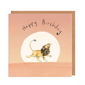 A square greetings card featuring an illustration of Arlo the Lion walking across a pink sunset, with handwritten 'Happy Birthday' text. 