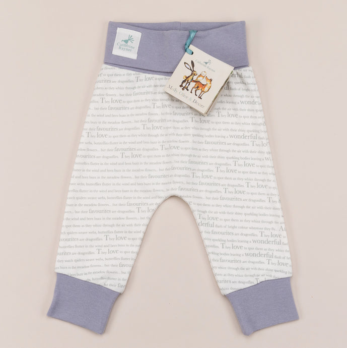 Unisex joggers for babies aged 0-2 years with exclusive Storytime print and  dusky heather trim, laid flat on a cream background.