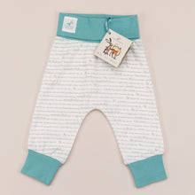 Load image into Gallery viewer, Unisex joggers for babies aged 0-2 years with exclusive Storytime print and  ocean blue trim, laid flat on a cream background.