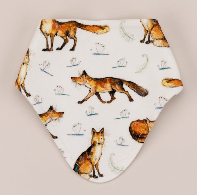 Bandana dribble bib featuring a dexter fox repeat print on a soft white cotton. 