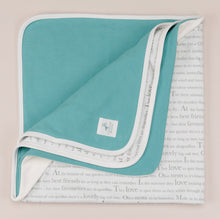 Load image into Gallery viewer, Molly hare baby wrap blanket folded flat to reveal storytime text back and blue lining