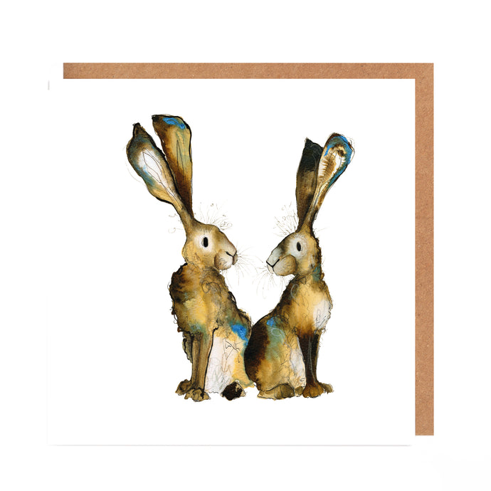A greetings card featuring an expressive watercolour illustration of two hares back to back.