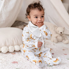 Load image into Gallery viewer, Six month old baby girl wearing olive owl babygrow and bib, with story text side facing out. 