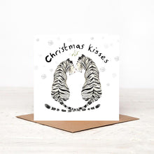 Load image into Gallery viewer, greeting card featuring a white tiger couple smiling at each other and &quot;Christmas kisses&quot; text above them