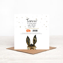 Load image into Gallery viewer, Christmas card stood on matching brown envelope showing the reverse side of Trevor Donkey Christmas card, featuring details of Christmas charity partner children&#39;s literacy charity Read for Good.