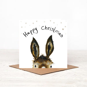 Square illustrated donkey Christmas card stood on matching brown craft envelope. 