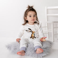Load image into Gallery viewer, 2 year old sat on a bean bag wearing Molly hare top and matching storytime joggers with dusky heather trim.