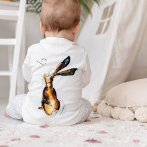 Baby modelling Molly hare long sleeve top, showing the back print